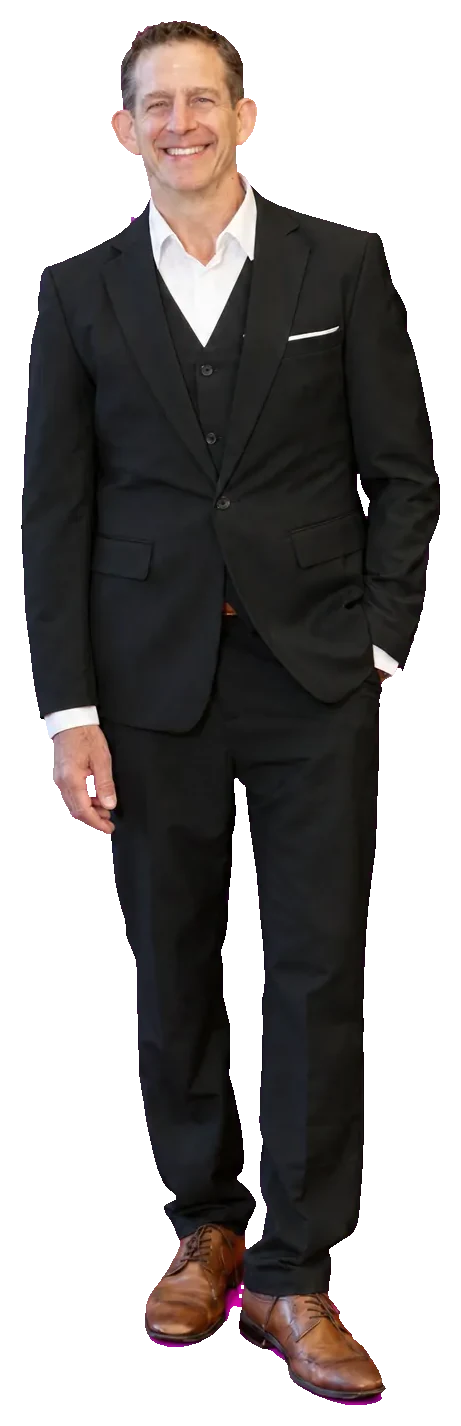 Rick Janson in a black three-piece suit