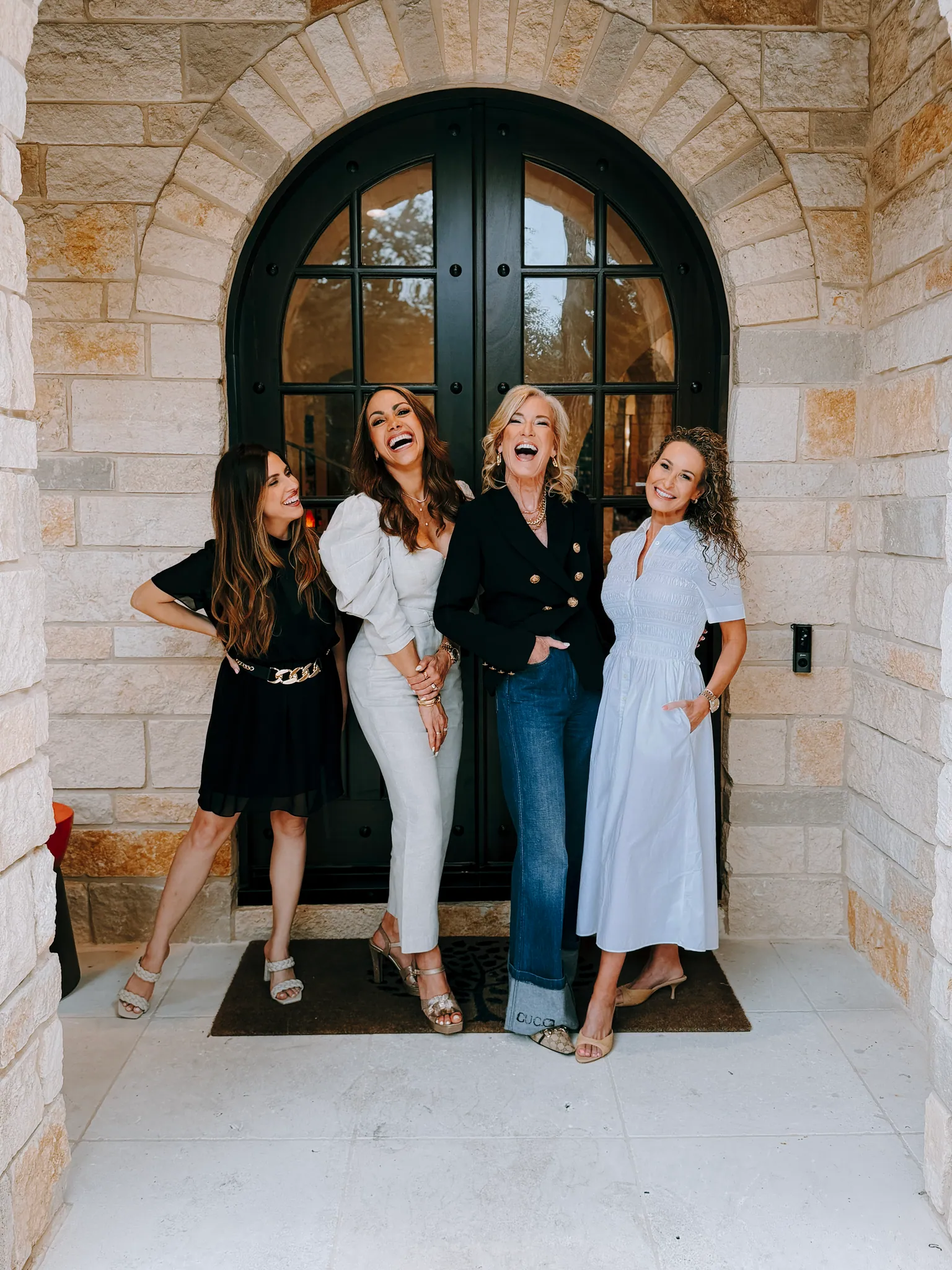 Four members of The Kink Team standing together outdoors.